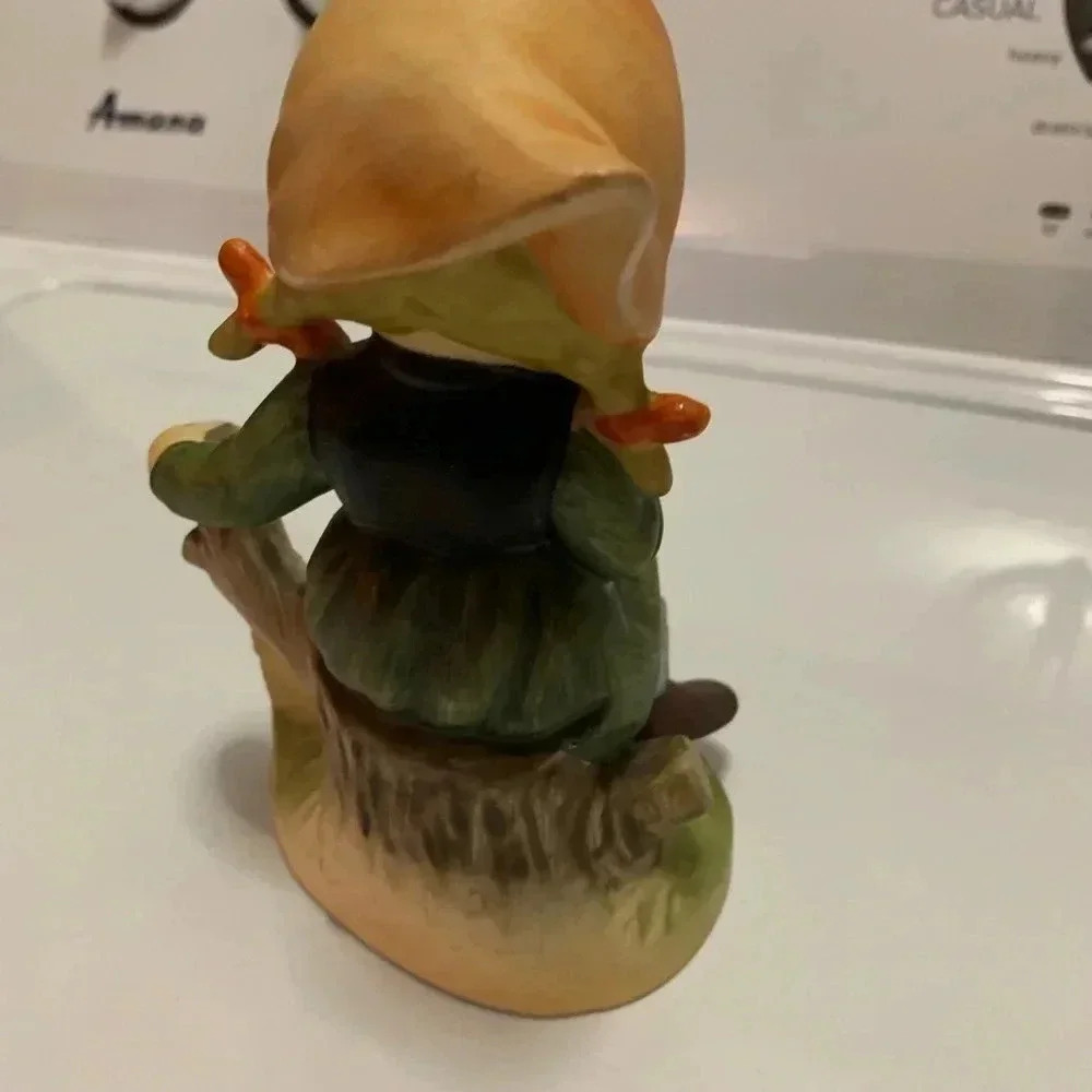 Girl Designed Figure Eatting a Banana on a Tree Stump - Picture 3 of 5